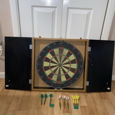 Dart board with cabinet and